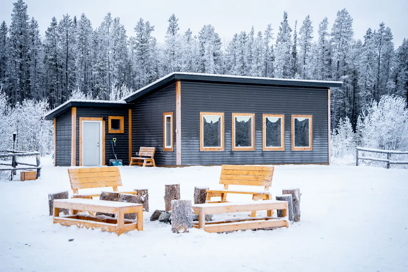 Aurora Lounge cabin in the snowy forest near Whitehorse